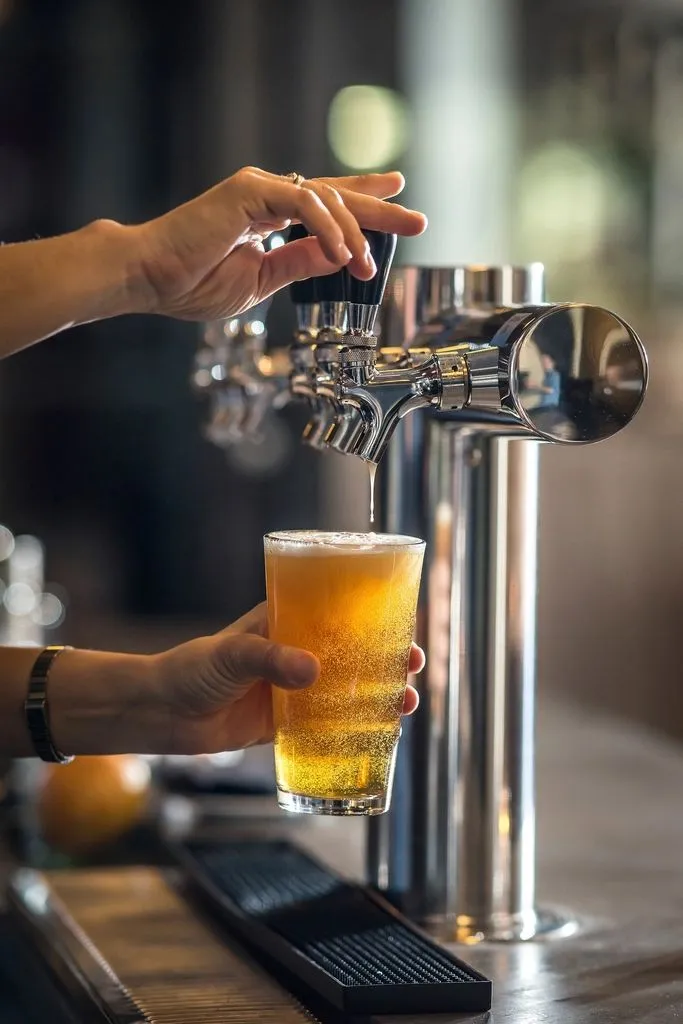 Bartender pouring a draft beer