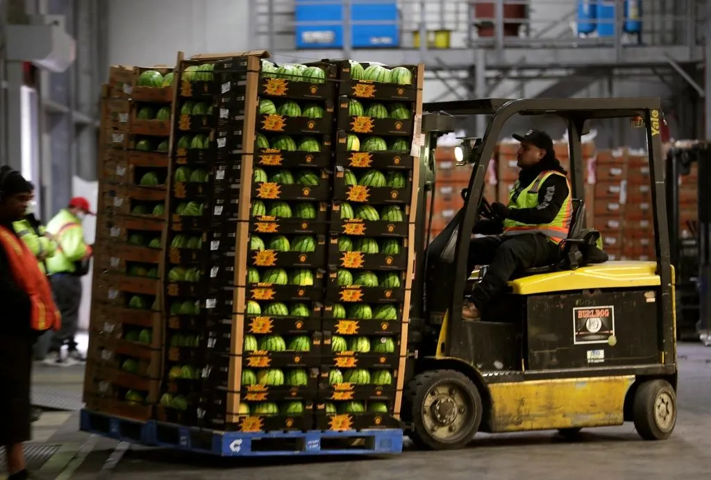 Forklift moving produce pallets